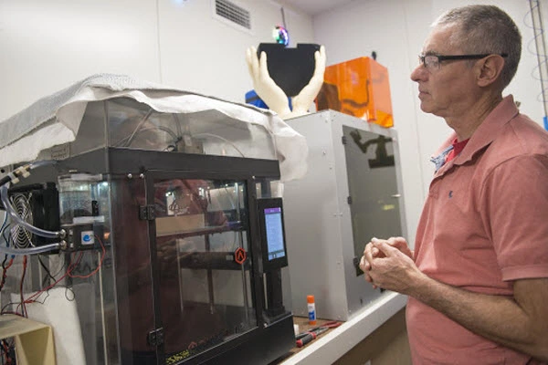 A man checking the machine