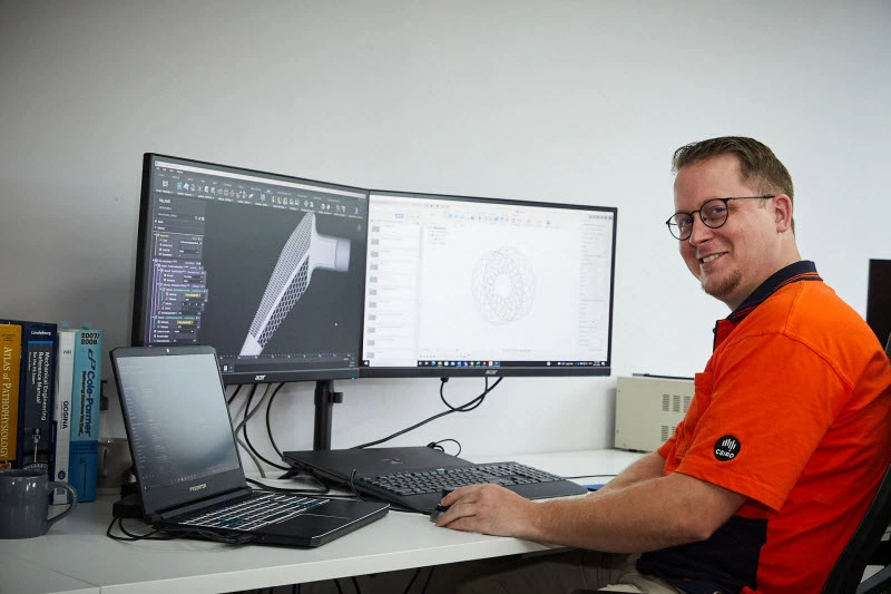 Employee happily working on his desktop