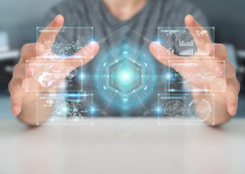 Businessman on blurred background using digital screens interface with holograms datas 3D rendering